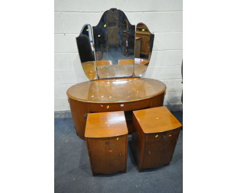 A MID CENTURY OAK OVAL DRESSING CHEST, with triple mirror, three drawers and two cupboard doors, width 129cm x depth 64cm x h