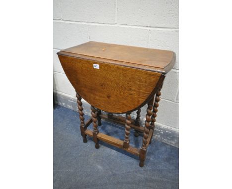 A SMALL OAK BARLEY TWIST GATE LEG TABLE