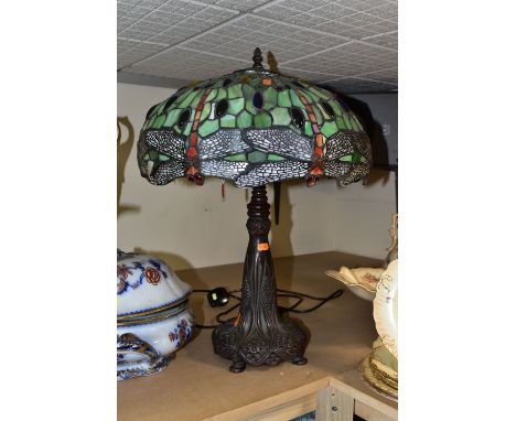 A LARGE MODERN TIFFANY STYLE LAMP, with a green, red and clear glass shade decorated with dragonflies and glass cabochons, ov