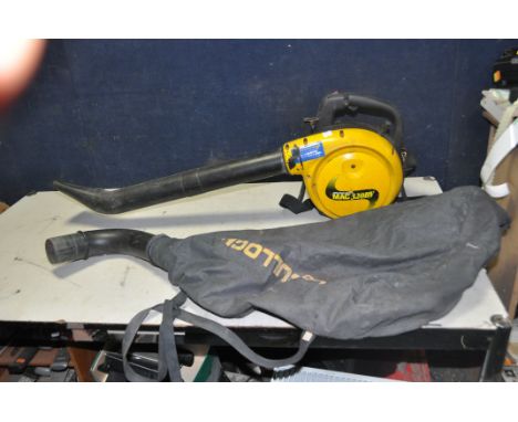 A McCULLOCH MAC320BV PETROL GARDEN BLOWER/VAC with collection bag (engine pulls freely and started first time)
