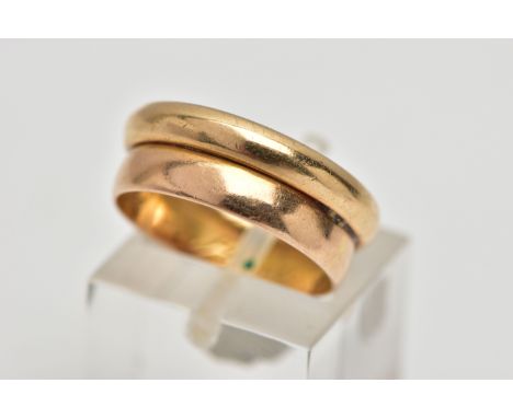 A DOUBLE BAND RING, two polished yellow gold bands soldered together, one stamped 18k, the other unmarked, both with personal