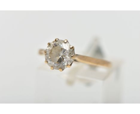 A 9CT GOLD SINGLE STONE RING, circular cut colourless cubic zirconia in a ten claw setting, pinched shoulders leading onto a 