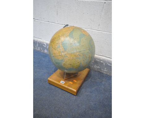 A VINTAGE PHILIPS 13 HALF INCH TERRESTRIAL GLOBE, on a teak base, height 43cm (condition:-some paper peeling/damaged, loose f