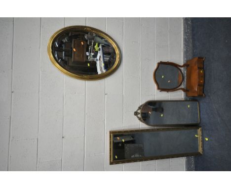 A GILT FRAMED OVAL BEVELLED EDGE WALL MIRROR together with a shield shaped dressing mirror, a gilt mirror rectangular mirror 