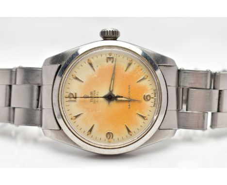 A 'TUDOR OYSTER' WRISTWATCH, hand wound movement, round cream dial signed 'Tudor Oyster Royal', Arabic twelve, three, six and