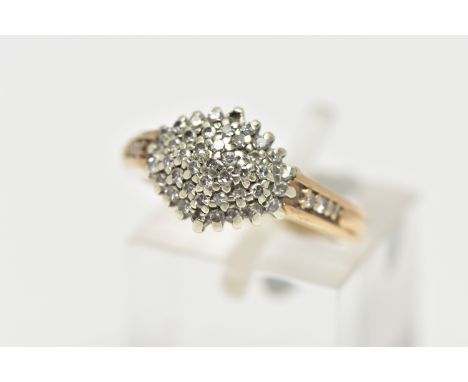 A 9CT GOLD DIAMOND CLUSTER RING, of a marquise form set with single cut diamonds, single cut diamond set shoulders, polished 