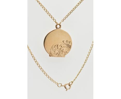 A 9CT YELLOW GOLD LOCKET AND CHAIN, the circular locket with scrolling engraved detail, hallmarked 9ct Birmingham 1971, appro