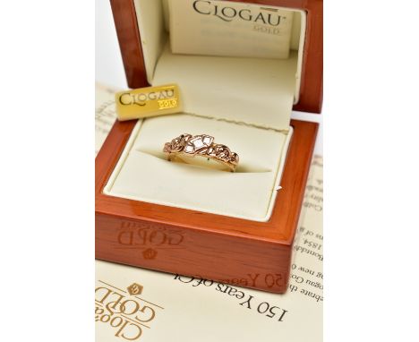 A 18CT GOLD 'CLOGAU' THREE STONE DIAMOND RING, a limited edition Welsh gold tree of life ring, rose gold foliage detail set w