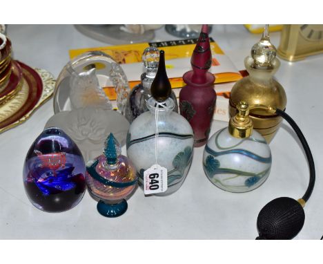 A COLLECTION OF DECORATIVE GLASS PERFUME BOTTLES, REFERENCE BOOKS AND TWO PAPERWEIGHTS, including an iridescent Okra atomiser