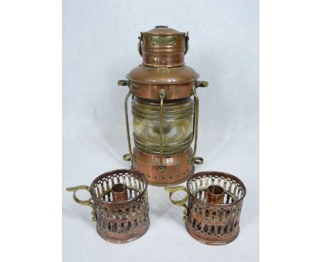 COPPER SHIP'S LAMP marked 'Anchor', 30cms H and a pair of pierced copper candleholders, stamped to the base 'G B N', 8cms H 