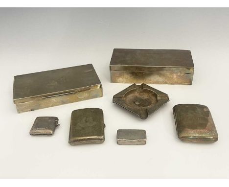 Two twentieth-century silver cigarette boxes, each of rectangular form with wood-lined interior, length 16.8cm, together with