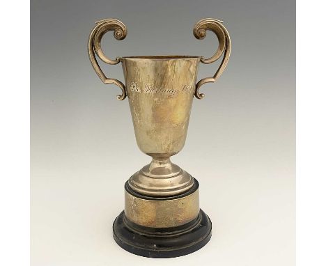 The Furlong Cup.An Elizabeth II silver trophy cup, of tapering cylindrical form, with twin double-scroll handles, atop a step