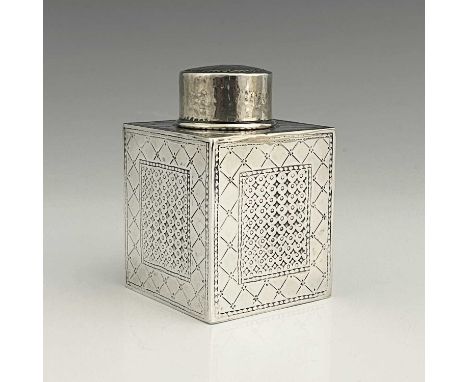 Bernard Cuzner for Liberty and Co.A George V Arts and Crafts silver tea caddy, of cuboid form, incised with diaper framed pan