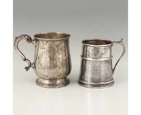 A George V silver mug, of baluster form, atop a spreading stepped circular form base, with double C scroll handle and acanthu