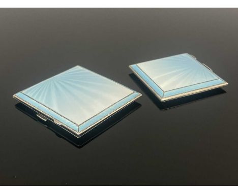 Asprey.A George VI Art Deco style silver and enamel compact and cigarette case set, each of panelled rectangular form, the co