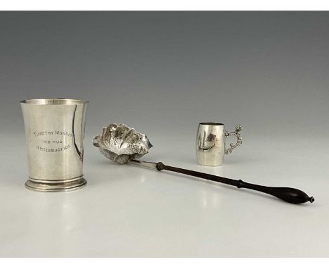 A George V silver Art Deco style mug, of slightly flared form, Hukin &amp; Heath, Birmingham 1933, height 9cm, together with 