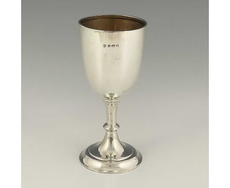 An Edwardian silver goblet, the tapered ovoid bowl atop a baluster stem and flared circular form foot, the interior gilt, Wil