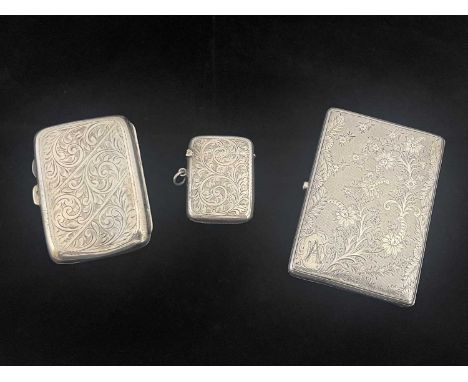 A late Victorian silver aide memoir, of rounded rectangular form, the exterior decorated with engine-turning, flowerheads and
