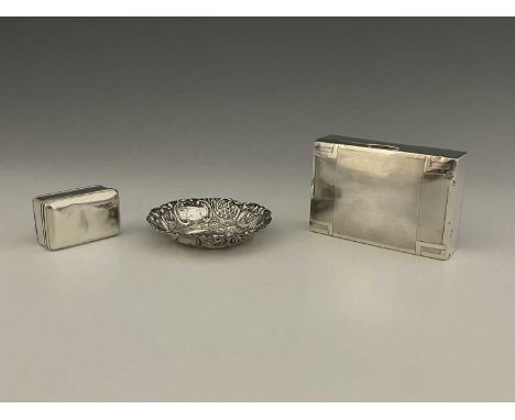 A George VI silver cigarette box, in the Art Deco style, of rectangular form with engine-turned decoration, the hinged cover 