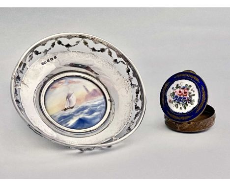 A George V silver bon bon dish, with reticulated rim and inset ceramic Royal Worcester plaque decorated with a sailboat and l