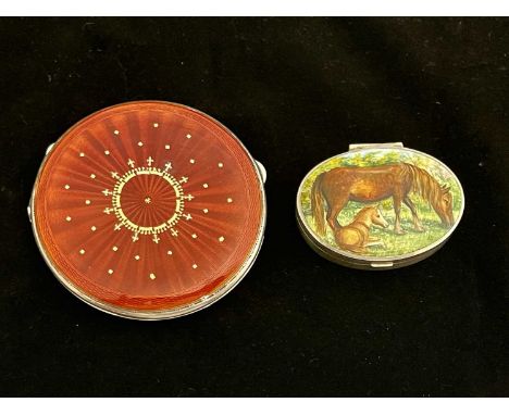 A twentieth-century silver compact, the cover with guilloche enamel in shades of red and gold, the underside with engine turn