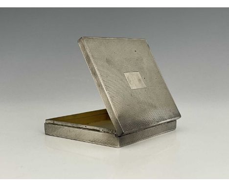 A George VI silver cigarette case, of rectangular form, the body decorated with engine turning with vacant central rectangula