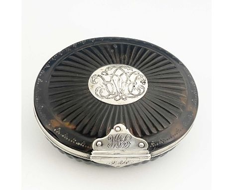A late seventeenth-century William and Mary tortoiseshell and silver-mounted tobacco box, of oval form, with squeeze action m