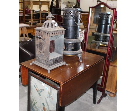 		A Victorian Wright and Butler petroleum stove, a parrafin heater, dropleaf table, tapestry firescreen and a cheval mirror