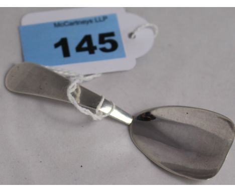		A George III silver rat tail caddy spoon with shield form bowl. London 1797. C.R. All good