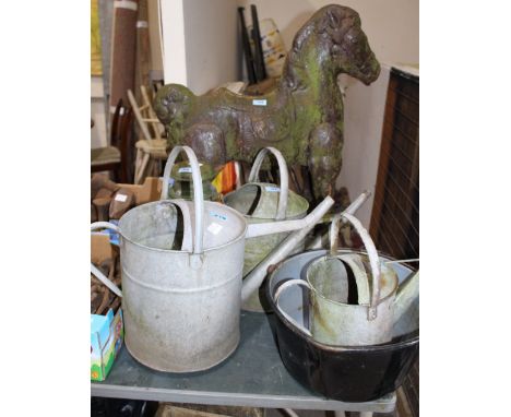 		Three watering cans, tilly lamp, jam pan and a 1950's horse ride-on toy