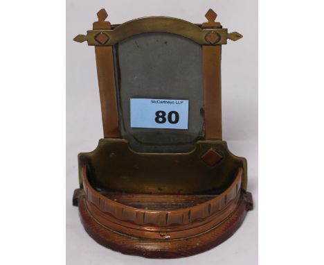 		A World War I Trench art photograph frame, with demi-lune galleried trinket shelf. 5 1/2' high