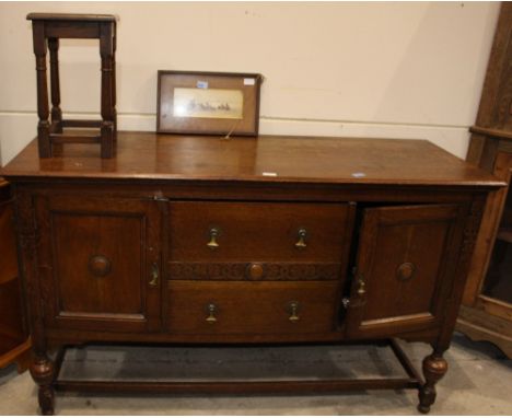 		A 1930's oak sideboard, occasional table and a framed print