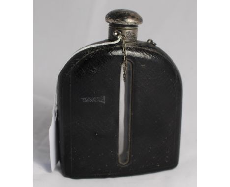 		A Victorian leather covered hip flask with plated screw top. 5 1/2' high. C.R. Good