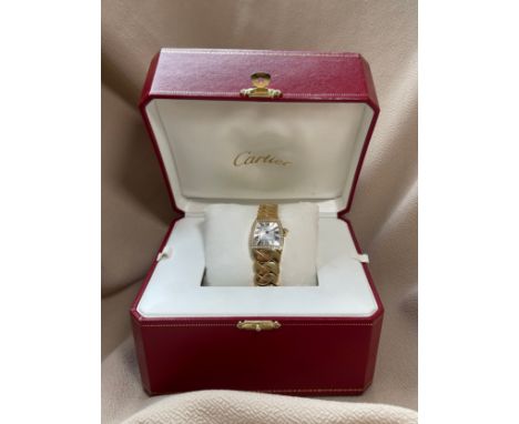 Cartier 18ct Yellow Gold La Dona de Cartier Wristwatch full set. This watch features a silver dial with black roman numeral h