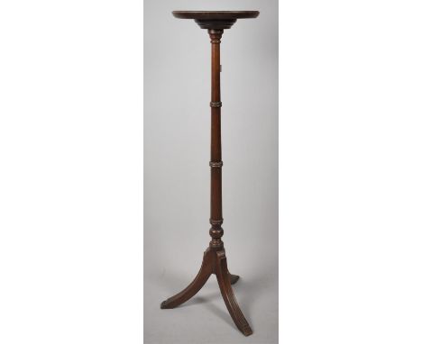 A Circular Topped Mahogany Torchere on Tripod Support, 100cm high 