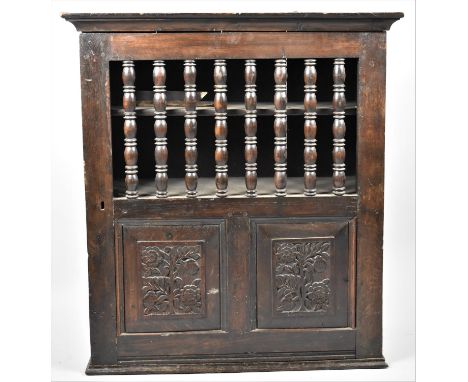 A Late 18th/Early 19th Century Oak Wall Hanging Bread Cupboard, the Hinged Door with Panel Base and Spindle Top, 78x29x86cm h