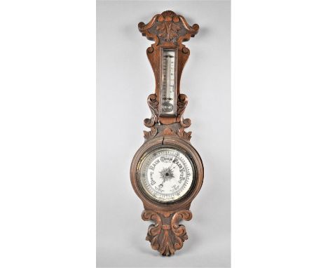 A Late Victorian Carved Oak Aneroid Wheel Barometer with Temperature Scale, 62cm High 