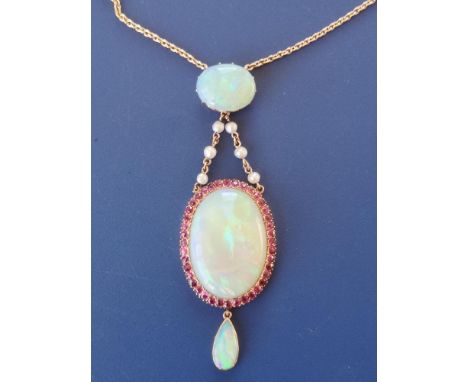 A late Victorian&nbsp; opal, ruby &amp; pearl set pendant necklace in yellow metal, the principal oval opal measuring 24mm se
