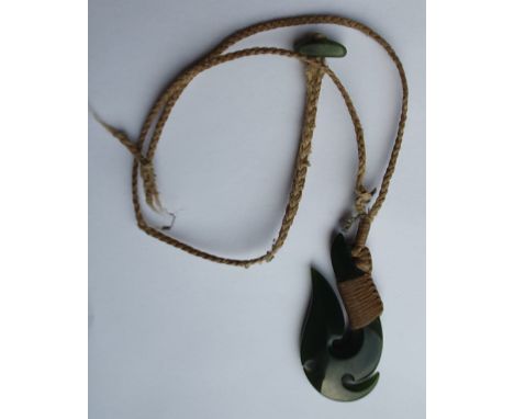 A Maori pounamu jade pendant in the form of a fish hook, 2".