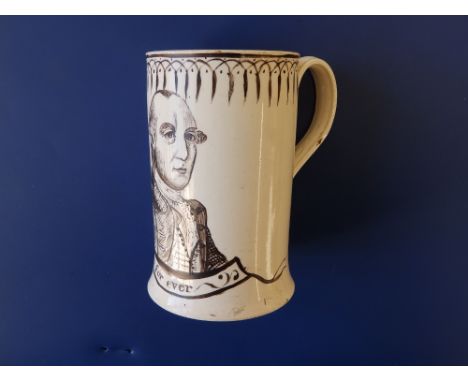 A George III creamware 'Admiral Rodney' mug, of slender cylinder form, moulded flowering leafy terminals to the loop handle, 