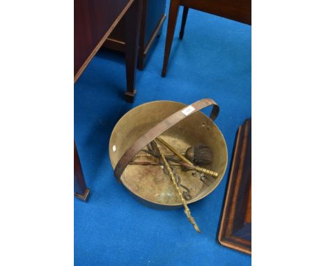 A brass jam pan and selection of fire tools