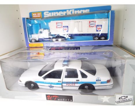 UT Models - a 1:18 scale model Chicago Police Car and a Matchbox SuperKings model Peterbuilt Refrigerator Truck # K-31, both 