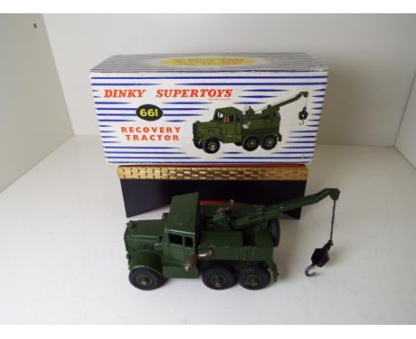 Dinky Supertoys - a Recovery Tractor # 661 military green body and hubs, crane fully functional, driver in cab, in original b