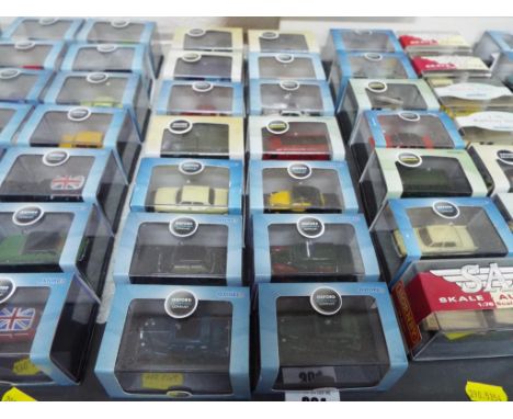 Fourteen diecast model motor vehicles to include Oxford Military, Oxford Automobile Co and Oxford Commercials all in perspex 