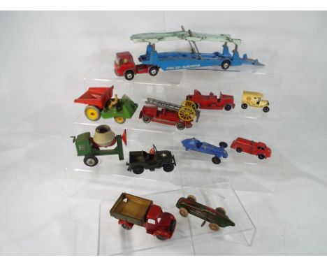 DCMT Crescent - a collection of metal diecast models comprising a Tanker, red # 423 ca 1949, a Cement Mixer, a fire engine (l