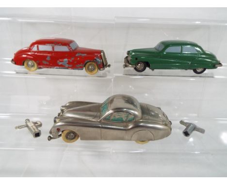 Prameta - three Prameta diecast clockwork model vehicles to include Jaguar XK120 in chrome with white tyres, Buick 405 in gre