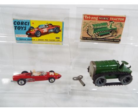 A Ferrari Formula One model #154 by Corgi Toys in excellent + condition, in excellent box and a Triang clockwork Minic tracto