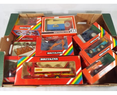 Britain's Ltd - A collection of 9 Britain's farming vehicles and implements to include, a Volvo tractor # 9521, a set of anim