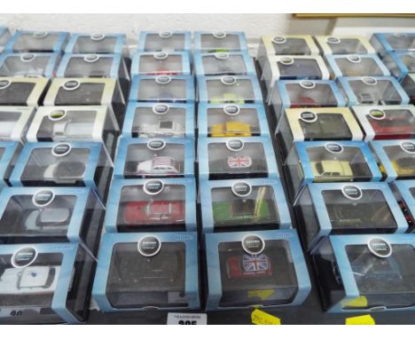 Oxford - fourteen diecast model motor vehicles by Oxford Automobile in presentation cases with paper sleeves