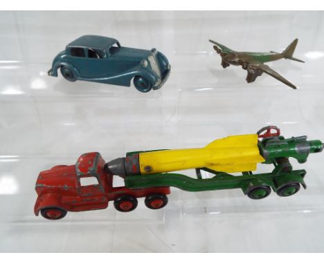 Crescent Toys - a mobile space rocket by Crescent with red cab, green trailer and rocket, a Crescent Rolls Royce and an army 